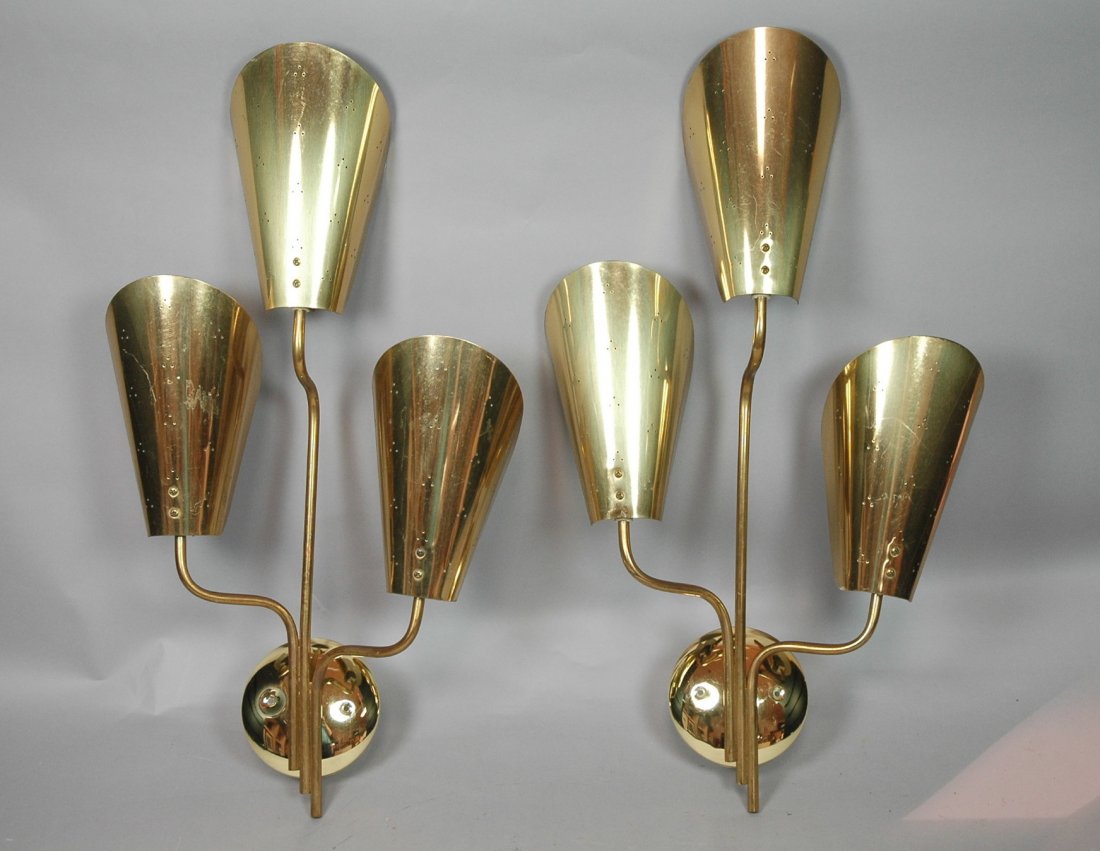 Pair Brass Wall Sconces. Modernist form with pier: Pair Brass Wall Sconces. Modernist form with pierced shades. Three arm.-- Dimensions: H: 27 inches: W: 16 inches: D: 9 inches ---