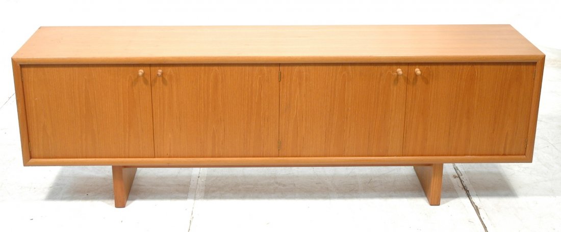 Long Blond Teak Danish Modern Credenza. Four door: Long Blond Teak Danish Modern Credenza. Four door cabinet with round wood pulls. Interior shelves. -- Dimensions: H: 27.75 inches: D: 18 inches: L: 84 inches ---