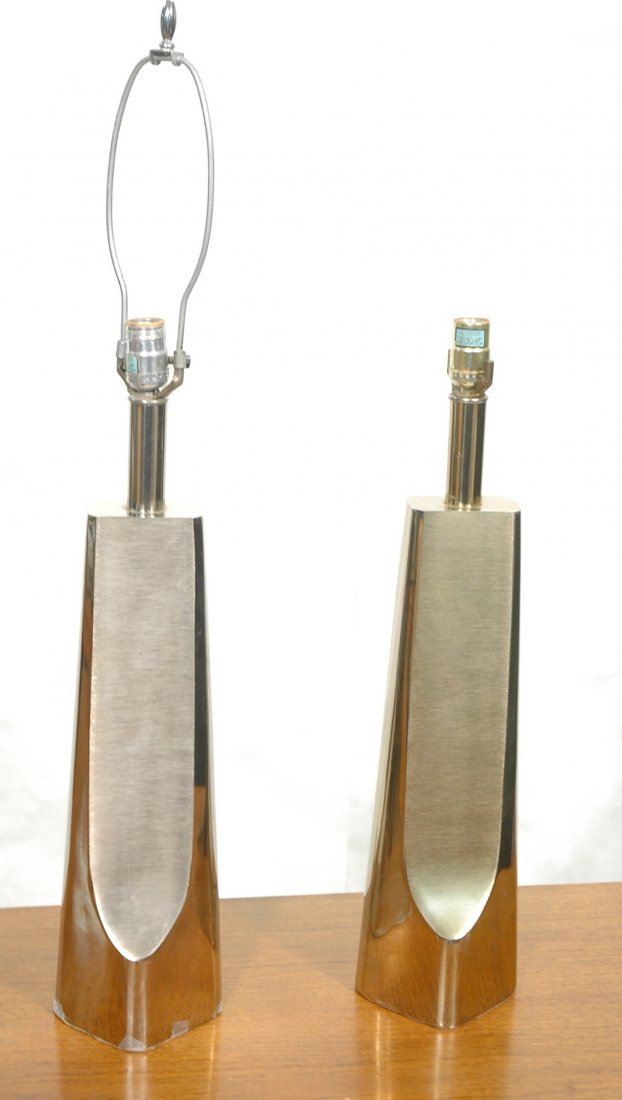 2pcs LAUREL Brutalist Metal Table Lamps. One has: 2pcs LAUREL Brutalist Metal Table Lamps. One has silver finish. One has faint light gold finish. -- Dimensions: H: 34 inches ---