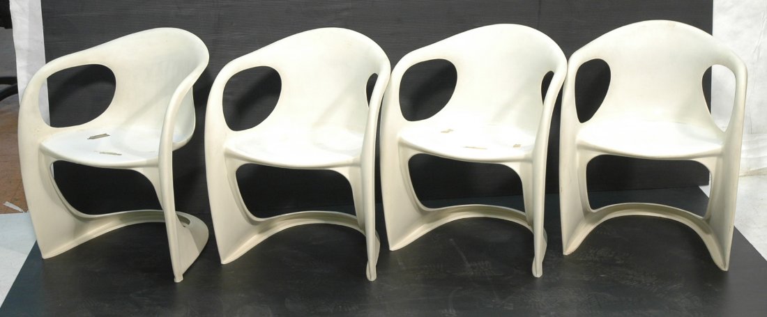 4 Plastic ALEXANDER BEGGE Stacking Dining Chairs.: 4 Plastic ALEXANDER BEGGE Stacking Dining Chairs. White freeform molded plastic frame. Alexander Begge for CASALA. Germany. Unmarked. 4 pcs-- Dimensions: H: 28 inches: W: 22.5 inches: D: 23 inches ---