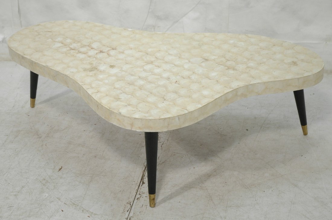 Capiz Shell Biomorphic Cocktail Coffee Table. Bla: Capiz Shell Biomorphic Cocktail Coffee Table. Black peg legs. -- Dimensions: H: 15.5 inches: W: 53 inches: D: 35 inches ---