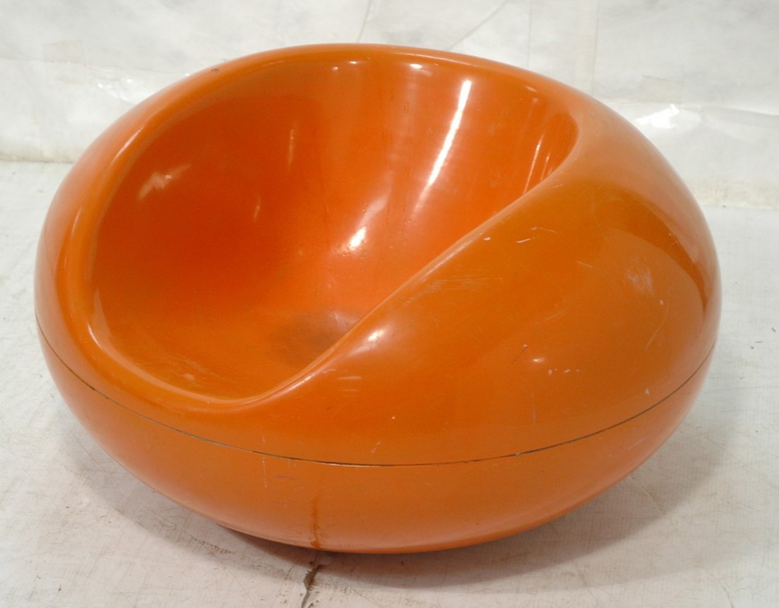 EERO AARNIO Orange Molded Plastic Lounge Chair. T: EERO AARNIO Orange Molded Plastic Lounge Chair. Two part molded chair. -- Dimensions: H: 22 inches: W: 38 inches ---