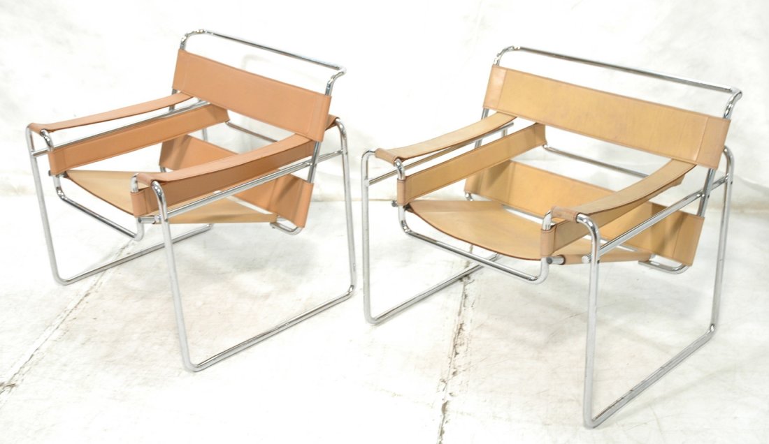 Pr Tan Leather WASSILY Chairs. Marcel Breuer. Tub: Pr Tan Leather WASSILY Chairs. Marcel Breuer. Tubular chrome frame. Knoll. Tubes have solid ends, not caps.-- Dimensions: H: 29 inches: W: 31 inches: D: 27 inches ---