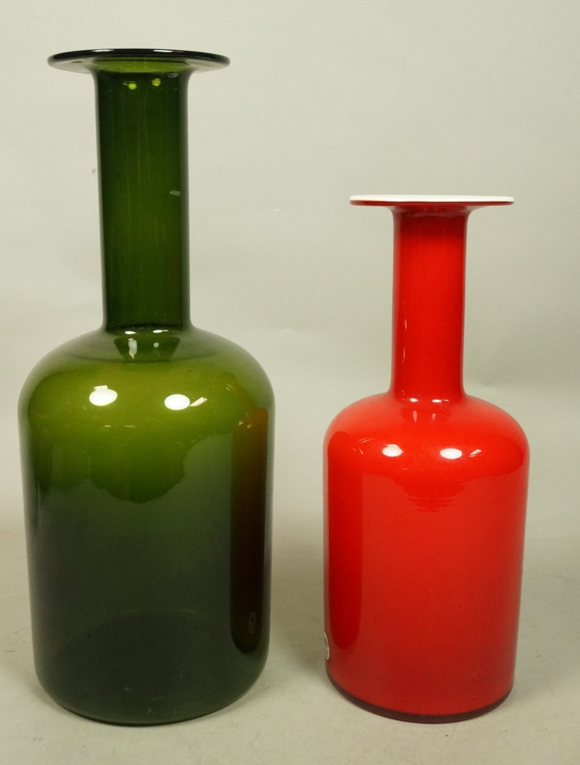 Two Bottle Form Art Glass Vases. One HOLMEGAARD C: Two Bottle Form Art Glass Vases. One HOLMEGAARD Cased glass with red over white. Other is clear olive glass; not marked. Red vase has Holmegaard label.-- Dimensions: H: 15 inches: W: 6 inches --- US S