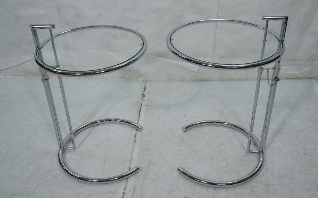 Pr Eileen Gray Style Chrome Tube Side Tables. Adj: Pr Eileen Gray Style Chrome Tube Side Tables. Adjustable height. Round inset glass.-- Dimensions: H: 29.5 inches: W: 20 inches ---