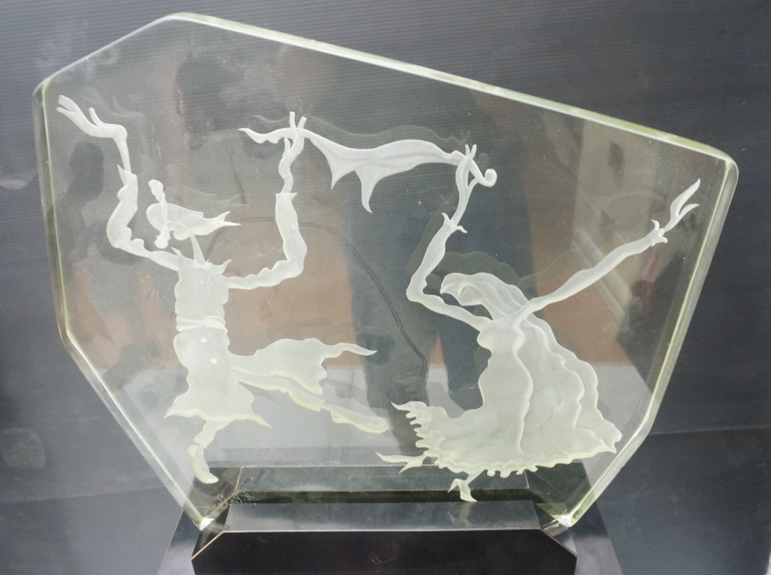 H. PERLMAN Etched Glass Sculpture on Pedestal. Da: H. PERLMAN Etched Glass Sculpture on Pedestal. Dancing Couple. 1" thick glass. Custom Black Laminate Base. Signed. Sculpture in Base is 17" H x 16.5"W x 8.25"D. Pedestal is 39"H. -- Dimensions: ---