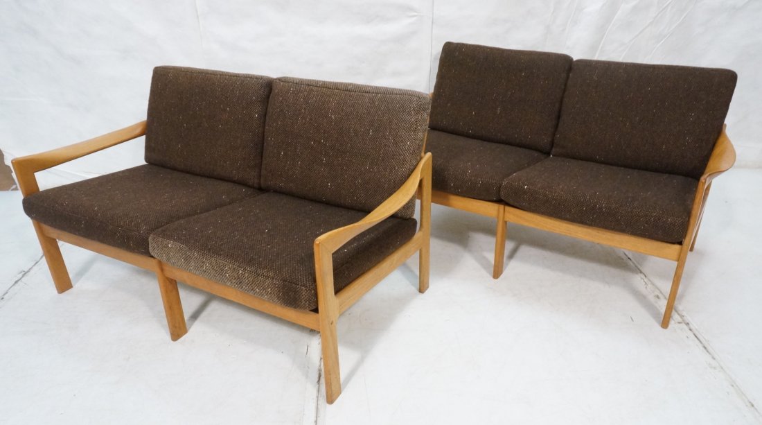 Pair Danish Modern Teak Loveseats. Pair 2 seat l: Pair Danish Modern Teak Loveseats. Pair 2 seat love seats. Wide bow arms. Curved arms. Brown upholstery.-- Dimensions: H: 30 inches: W: 53 inches: D: 28.5 inches ---