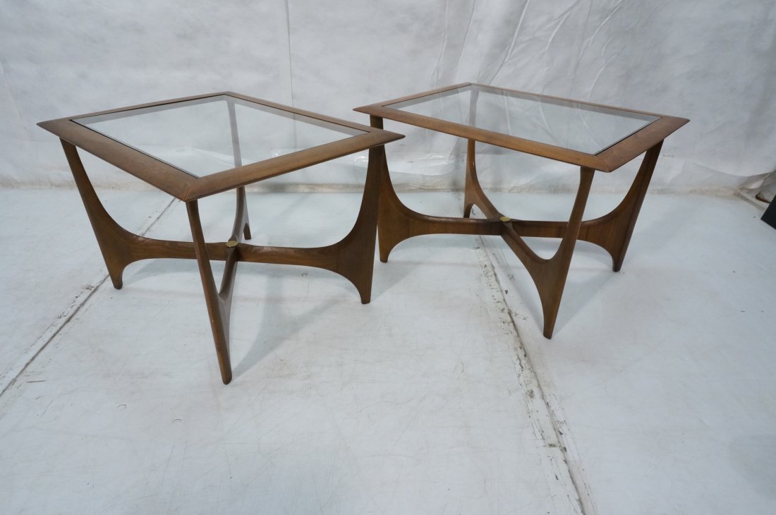 LANE Pr American Modern Walnut Side Tables. Shape: LANE Pr American Modern Walnut Side Tables. Shaped legs with "X" stretcher base brass detail. Inset glass top. -- Dimensions: H: 20 inches: W: 30.5 inches: D: 23 inches ---