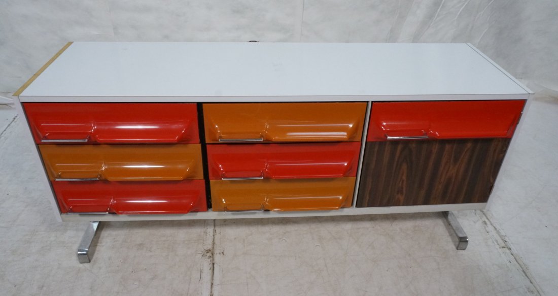 RAYMOND LOEWY style Low Dresser. TRECO Canada. Co: RAYMOND LOEWY style Low Dresser. TRECO Canada. Colored molded plastic drawers. White laminate frame. Flat wide chrome legs. Drawers with chrome metal pulls. -- Dimensions: H: 29.25 inches: D: 20.5 inc