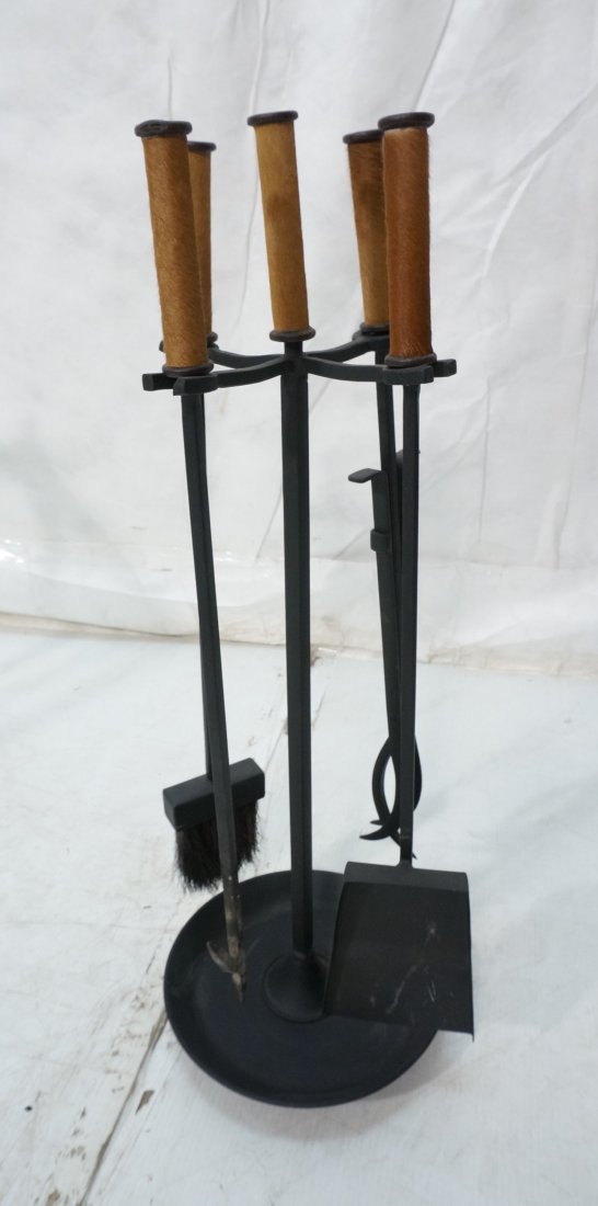 5pc Black Iron Fireplace Tool Set. Real Cowhide F: 5pc Black Iron Fireplace Tool Set. Real Cowhide Fur trimmed handles. Four tools & stand.-- Dimensions: H: 30 inches ---
