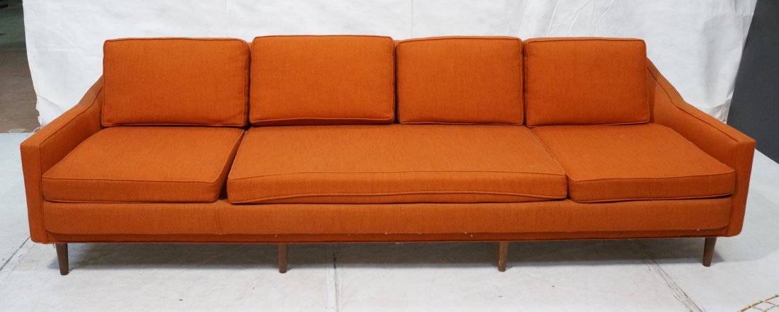 Modernist Sofa Couch with Arms. Red Orange Fabric: Modernist Sofa Couch with Arms. Red Orange Fabric. Tapered wood legs. Deep seat with low arms.-- Dimensions: H: 29 inches: D: 33 inches: L: 102 inches ---
