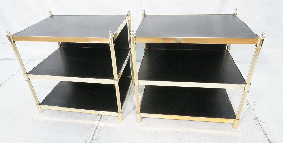 Pr Brass Directoire Three Tier Side End Tables. B: Pr Brass Directoire Three Tier Side End Tables. Brass Frames with Black Laminate Shelves. Acorn Finials.-- Dimensions: H: 29.5 inches: W: 29.25 inches: D: 21.25 inches ---