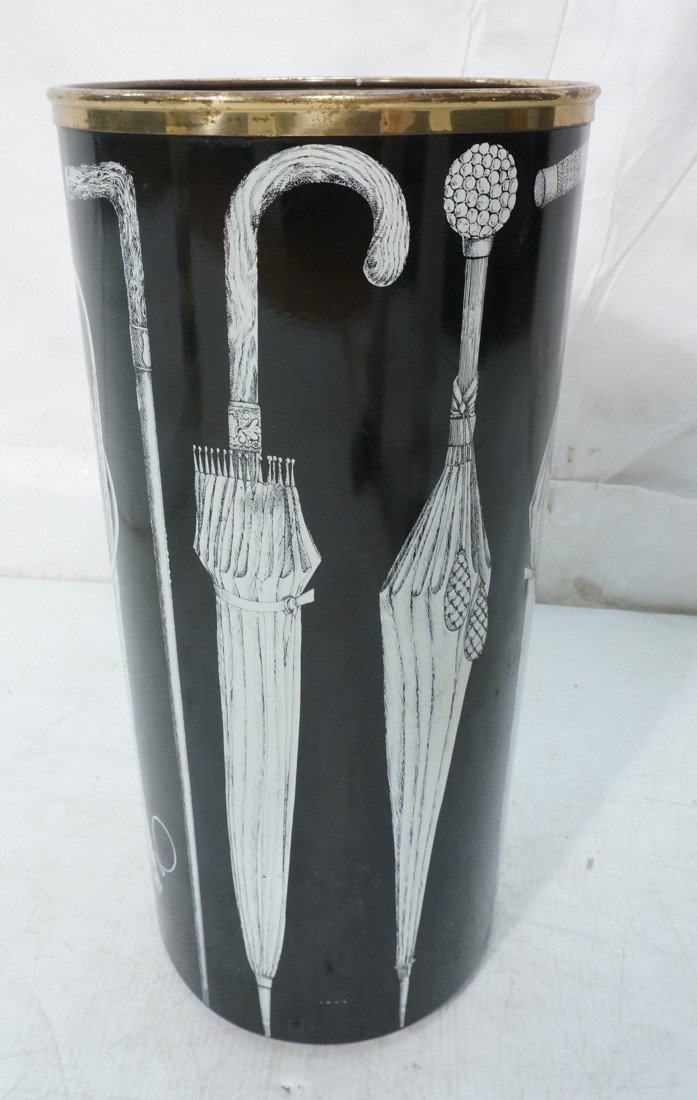 PIERO FORNASETTI Metal Umbrella Stand. Metal cyli: PIERO FORNASETTI Metal Umbrella Stand. Metal cylinder with graphic image of umbrellas. Brass feet and top trim. Original aluminum liner. Marked. -- Dimensions: H: 22.25 inches: W: 10.5 inches: D: 10.5
