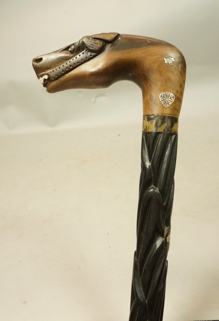 Hidden Sword Cane. Carved Horse Head Top. Silver: Hidden Sword Cane. Carved Horse Head Top. Silver Inlay. Carved shaft with inlaid medallions of Ram, dog, leaf swan & rabbits. "Y" Split base. Sword inside.-- Dimensions: H: 36 inches ---