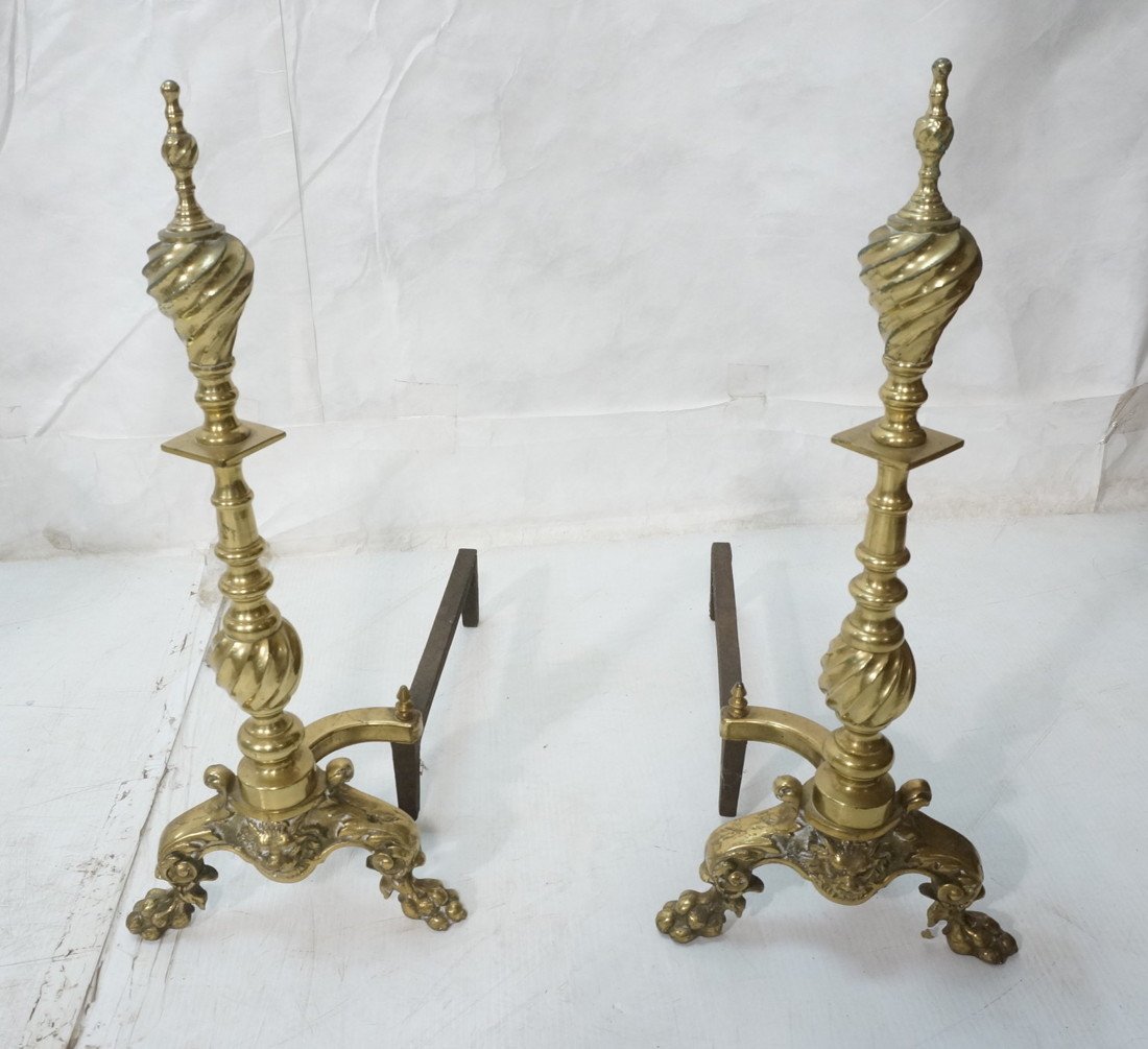 Brass Andirons with Lions Heads and Paw Feet. Dou: Brass Andirons with Lions Heads and Paw Feet. Double swirl designs. -- Dimensions: H: 24 inches: W: 10.5 inches: D: 19 inches ---