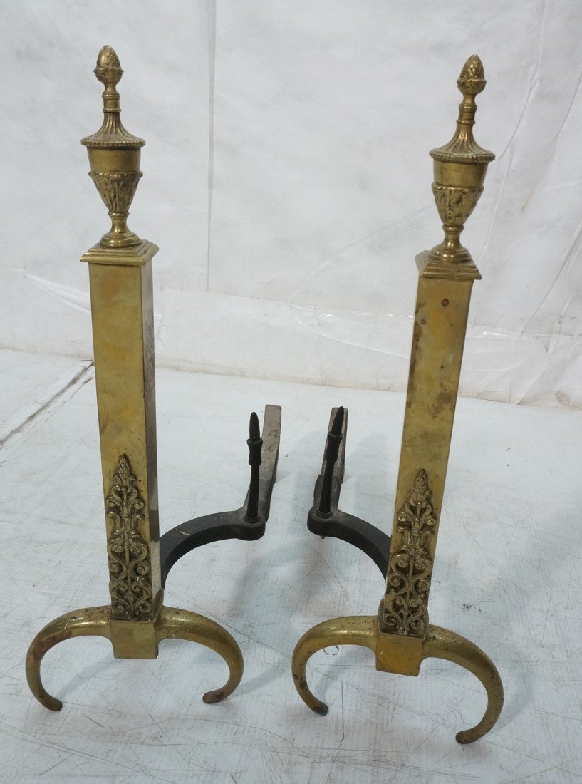 Antique Brass Andirons. Classical urn finials. S: Antique Brass Andirons. Classical urn finials. Square rods with applied decoration.-- Dimensions: H: 24.5 inches: W: 8.5 inches: D: 20 inches ---