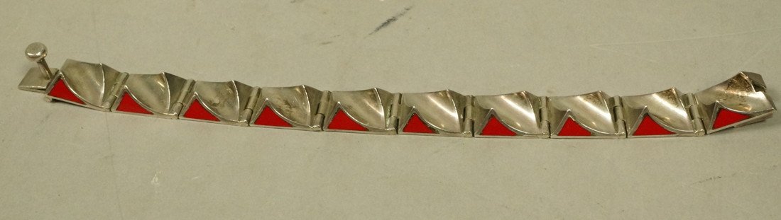 Sterling Red Stone Mexican Bracelet. Two peaks wi: Sterling Red Stone Mexican Bracelet. Two peaks with inset red elements. Marked Mexico 925. -- Dimensions: : L: 7.5 inches--- Weight: 1.85 Troy ozs. ---- --- US Shipping charge: $9