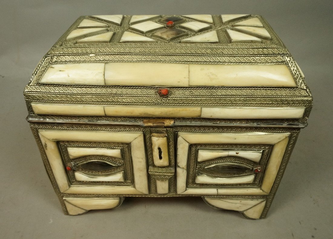 Bone and Metal Lidded Box. Lots of bone pieces m: Bone and Metal Lidded Box. Lots of bone pieces mounted in metal. Wood box. Some small coral pieces.-- Dimensions: H: 10 inches: W: 15 inches: D: 7.5 inches --- US Shipping charge: $35