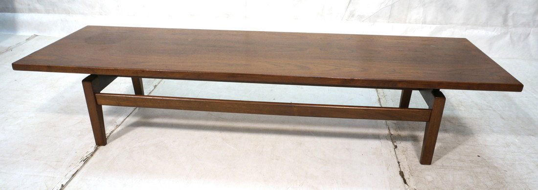 JENS RISOM American Modern Walnut Coffee Table. S: JENS RISOM American Modern Walnut Coffee Table. Square legs with raised overhanging top. Marked.-- Dimensions: H: 15 inches: W: 72 inches: D: 21 inches ---