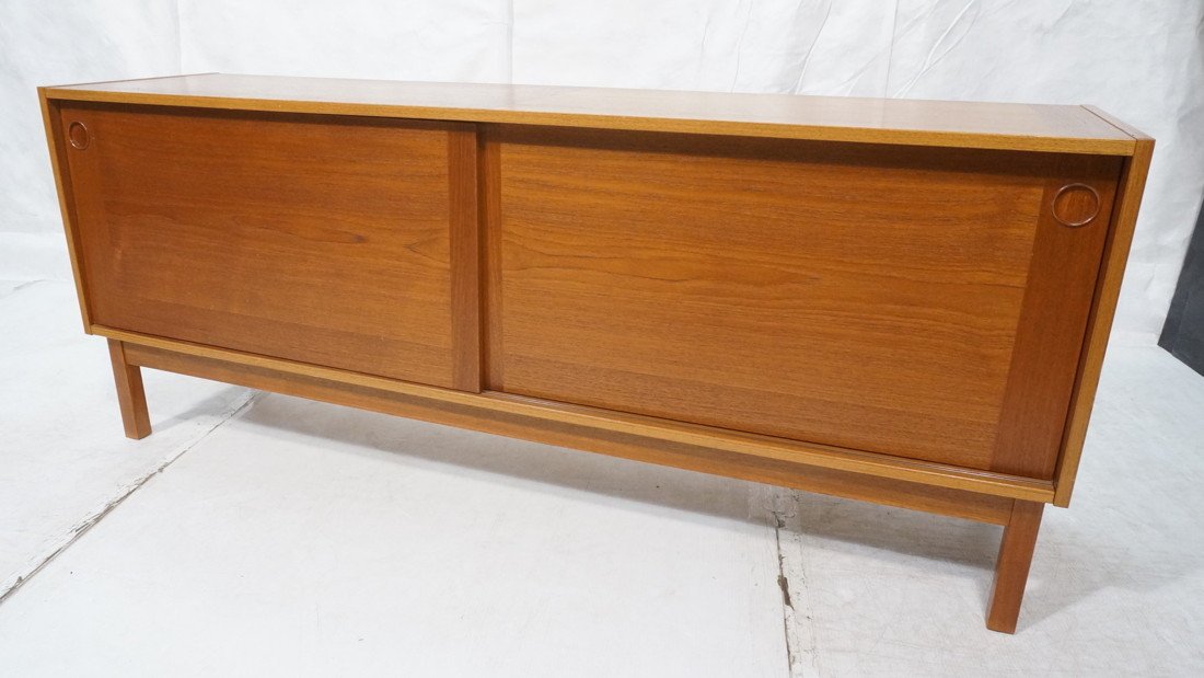 Danish Modern Teak Credenza Sideboard. Sliding do: Danish Modern Teak Credenza Sideboard. Sliding door cabinet on wood legs. Recessed wood pulls. -- Dimensions: H: 29.75 inches: D: 18.75 inches: L: 72.5 inches ---
