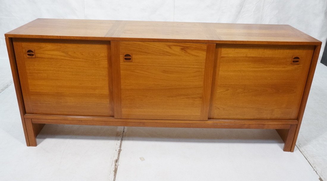 Danish Modern Teak Credenza Sideboard. Three slid: Danish Modern Teak Credenza Sideboard. Three sliding doors. Recessed wood pulls. -- Dimensions: H: 30.25 inches: D: 18.5 inches: L: 71 inches ---