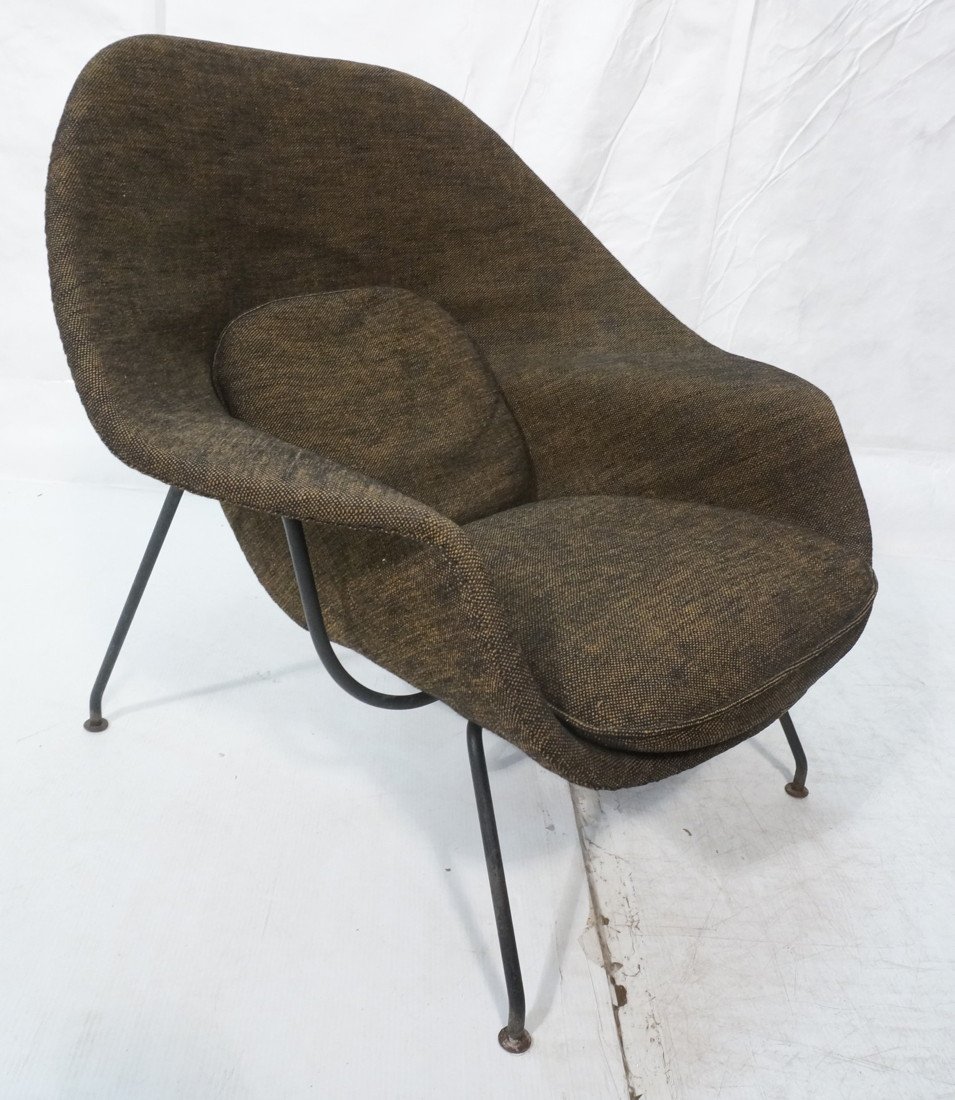 EERO SAARINEN Womb Chair. Lounge Chair. KNOLL. Bl: EERO SAARINEN Womb Chair. Lounge Chair. KNOLL. Black metal legs. Eero Saarinen designed the Womb Chair at Florence Knoll's request. The groundbreaking design provides a comforting sense of security -