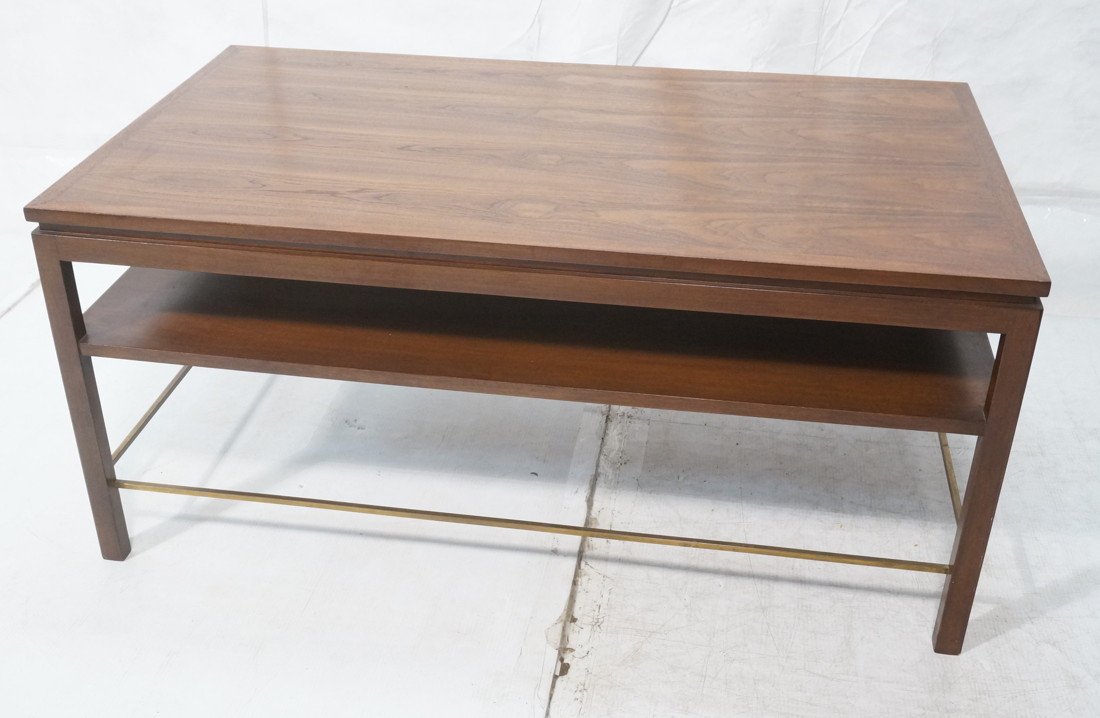 DUNBAR Walnut Banded Coffee Table. Two tier cockt: DUNBAR Walnut Banded Coffee Table. Two tier cocktail table. Brass stretchers. Metal Dunbar tag-- Dimensions: H: 22 inches: W: 48 inches: D: 28 inches ---