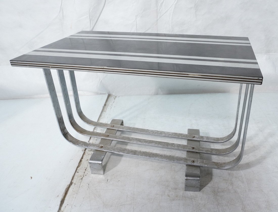 Vintage ART DECO Chrome Frame Side End Table. Thr: Vintage ART DECO Chrome Frame Side End Table. Three banded base. Black Laminate top with silver stripes. . -- Dimensions: H: 18 inches: W: 27 inches: D: 16 inches ---