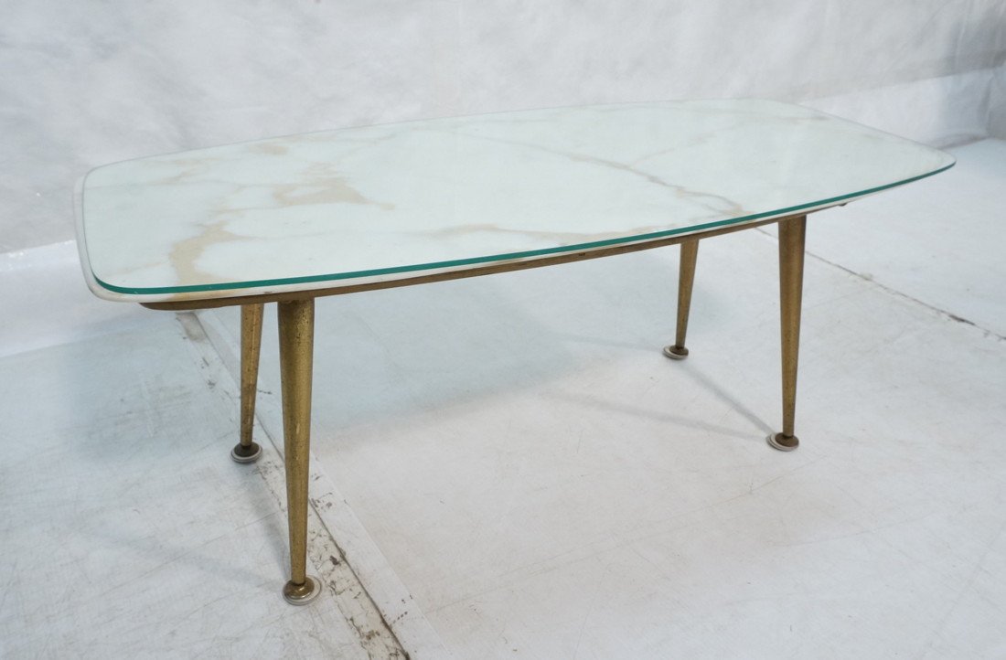 Modernist Italian White Marble Coffee Table. Tape: Modernist Italian White Marble Coffee Table. Tapered Metal Peg Legs. Shaped glass top. Marble mounted on wood. -- Dimensions: H: 16.5 inches: W: 39 inches: D: 18.5 inches ---