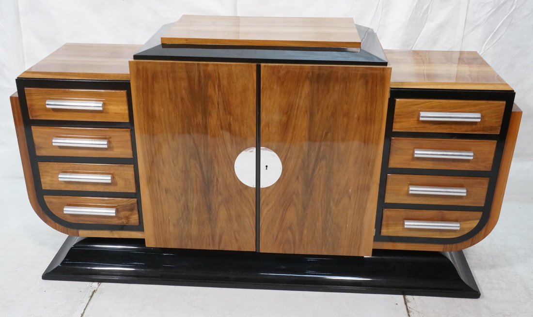 Art Deco Sideboard Buffet. High polish wood and: Art Deco Sideboard Buffet. High polish wood and black lacquer. Chrome pulls and front plate. Flared base. Has key.-- Dimensions: H: 39.5 inches: W: 69.5 inches: D: 19.5 inches ---