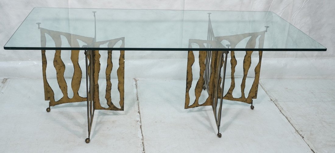 SILAS SEANDEL style Dining Table. 3/4" thick glas: SILAS SEANDEL style Dining Table. 3/4" thick glass on cut steel base. Gilt Brutalist Form. Not marked-- Dimensions: H: 30 inches: D: 42.25 inches: L: 84 inches ---