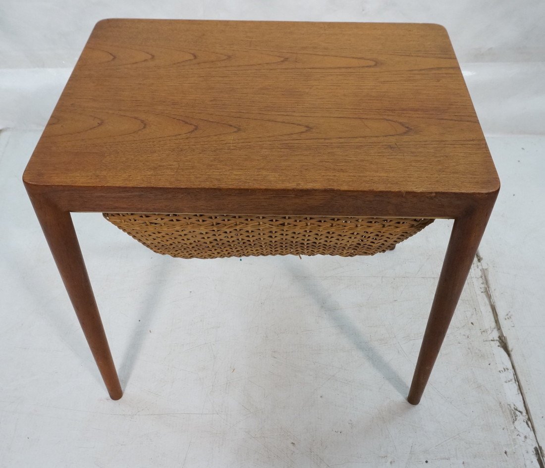Danish Modern Sewing Side Table. Teak. Woven wick: Danish Modern Sewing Side Table. Teak. Woven wicker basket. GEORGE TANIER, marked. Tapered peg legs.-- Dimensions: H: 20.75 inches: W: 23.25 inches: D: 17.25 inches ---