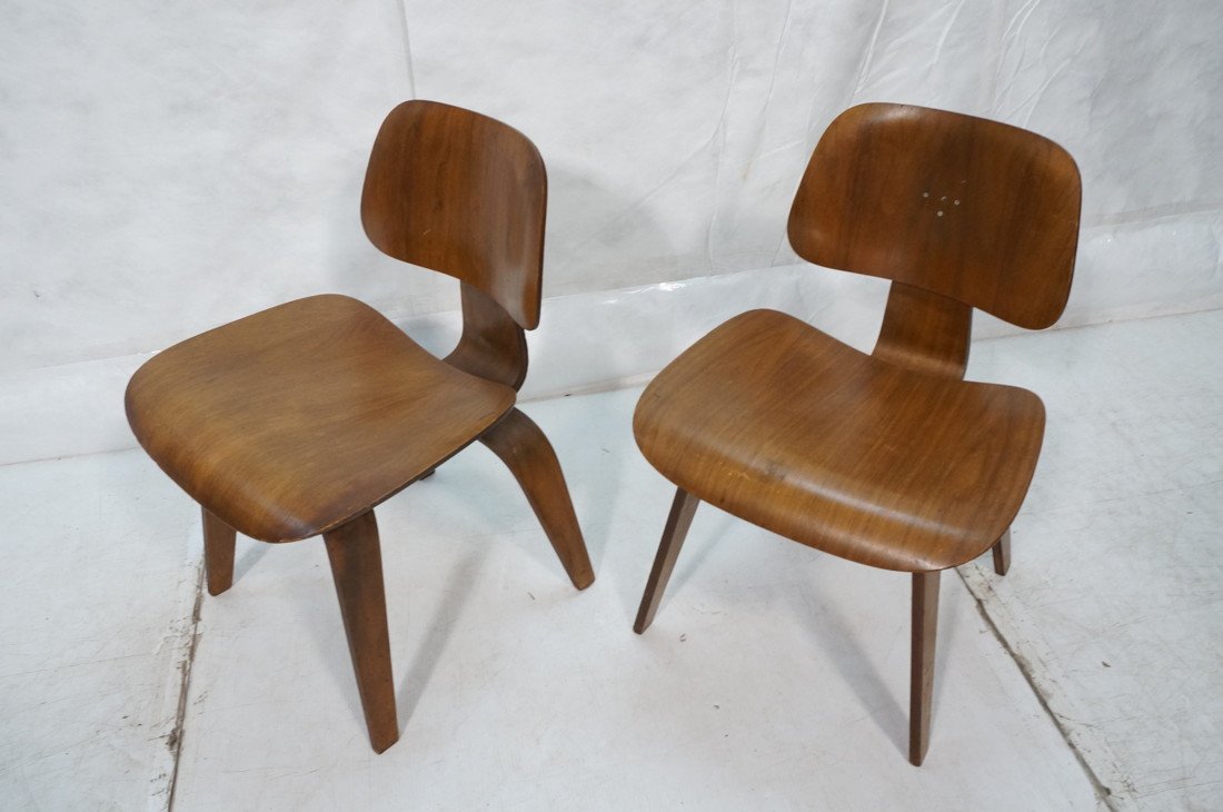 Pr Charles EAMES for HERMAN MILLER DCW Chairs. St: Pr Charles EAMES for HERMAN MILLER DCW Chairs. Stamped DCW. One has foil label.-- Dimensions: H: 29 inches: W: 19.5 inches: D: 21 inches ---