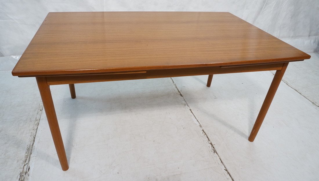 Teak Danish Modern Refractory Dining Table. Round: Teak Danish Modern Refractory Dining Table. Round Legs. Skirted top with pull out ends. -- Dimensions: H: 29 inches: W: 58.5 inches: D: 37.25 inches ---
