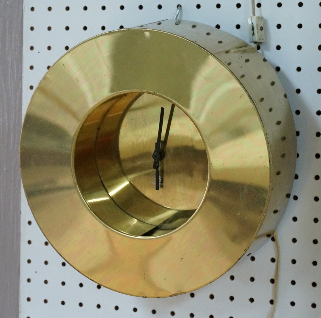 C JERE Brass Wall Clock. Deep Round Frame. Signed: C JERE Brass Wall Clock. Deep Round Frame. Signed C JERE '77. Clock face has Sauteur label.-- Dimensions: H: 12 inches: W: 5 inches ---