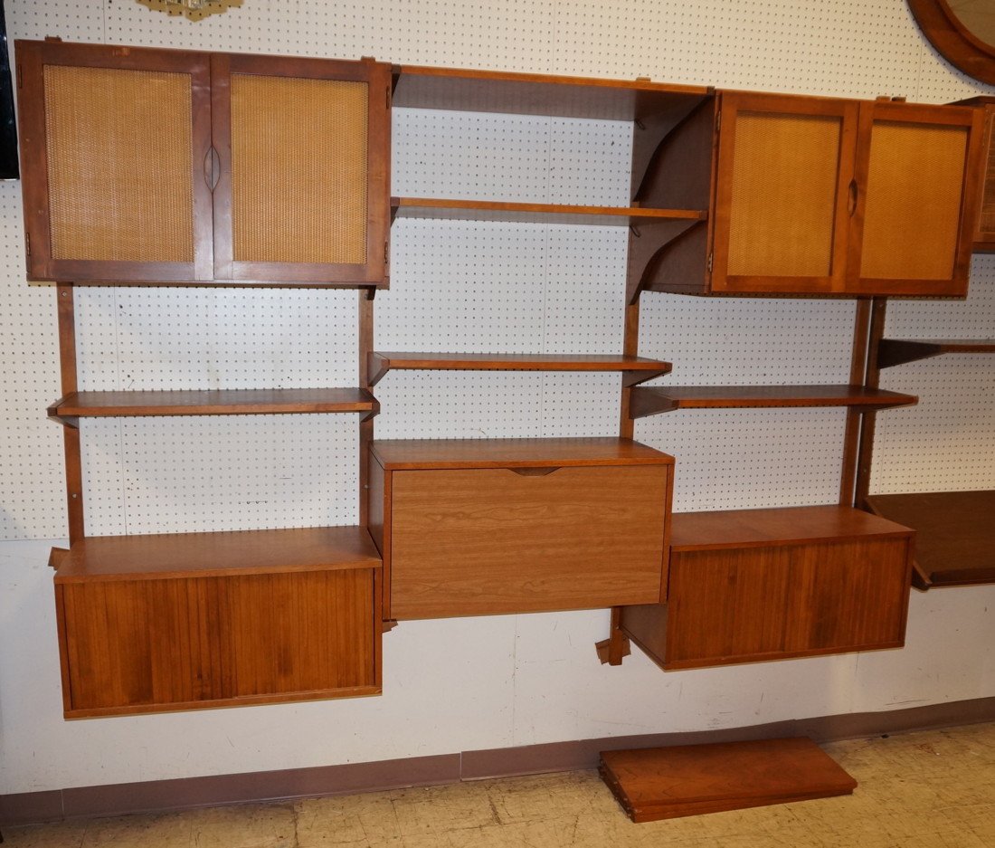 Modernist Wall Unit with drop down desk. (2) two: Modernist Wall Unit with drop down desk. (2) two door woven front cabinets. (2) two sliding door cabinets.-- Dimensions: H: 83 inches: D: 14 inches: L: 96 inches ---