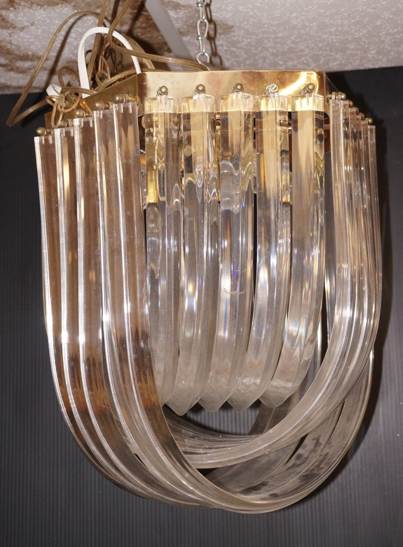 Lucite Banded Hanging Light Chandelier. "U" Shape: Lucite Banded Hanging Light Chandelier. "U" Shaped acrylic bands.-- Dimensions: H: 17.25 inches: W: 16 inches: D: 16 inches ---