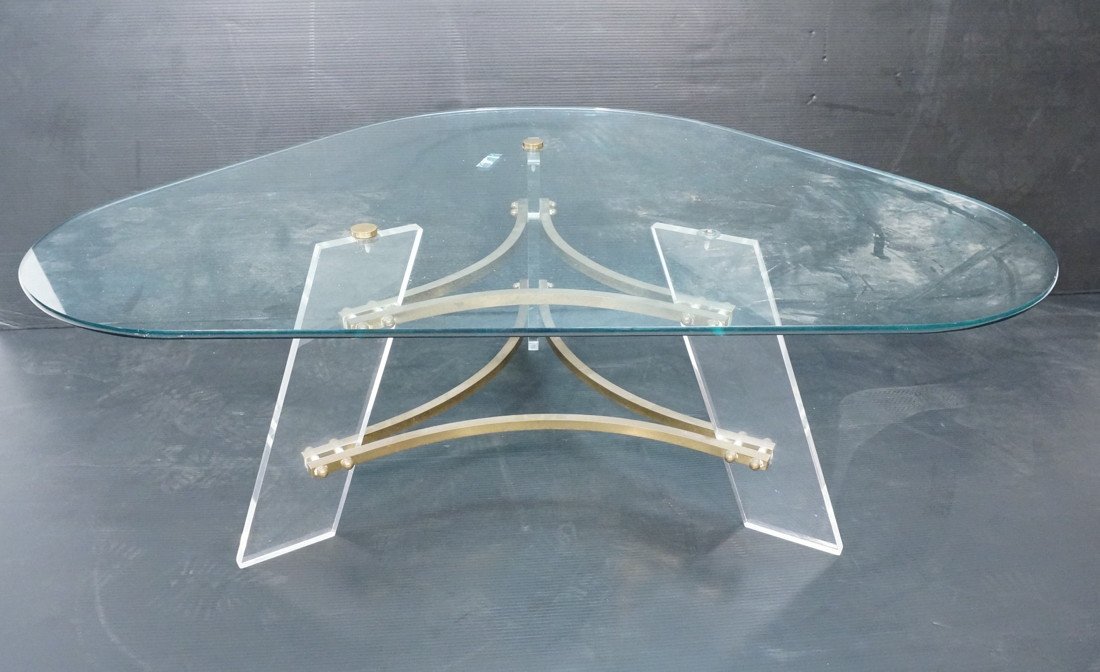 70's Modern Lucite & Brass Glass Top Coffee Table: 70's Modern Lucite & Brass Glass Top Coffee Table. Triangle shaped glass top.-- Dimensions: H: 16.75 inches: W: 47.25 inches: D: 34 inches ---
