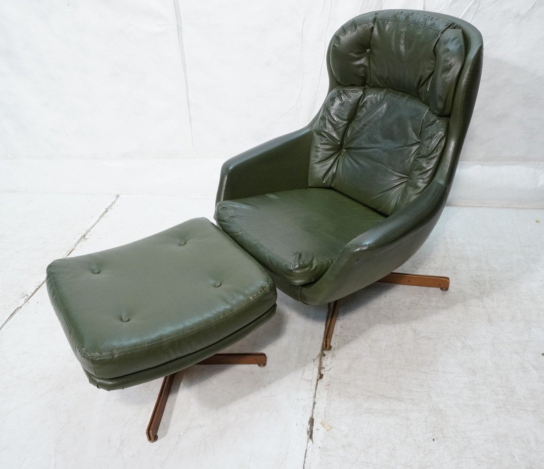 Green Vinyl SELIG Lounge Chair & Ottoman. Metal r: Green Vinyl SELIG Lounge Chair & Ottoman. Metal rod with wood feet. Selig label.-- Dimensions: H: 37.75 inches: W: 32 inches: D: 25 inches ---