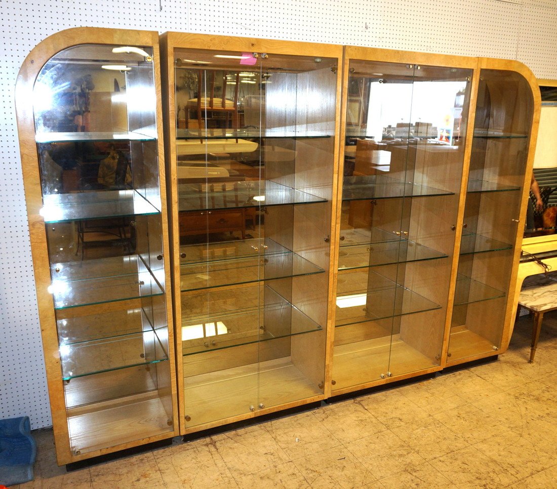 Four Section Burled Wood Wall Unit. Henredon Two: Four Section Burled Wood Wall Unit. Henredon Two curved top end sections. Glass doors. Interior shelves. All sections light. -- Dimensions: H: 79.5 inches ---