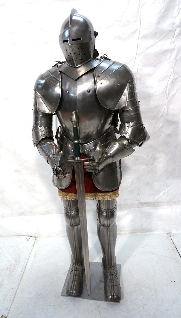 Reproduction suit of armor. Heavy steel suit of a: Reproduction suit of armor. Heavy steel suit of armor medieval style, very detailed with a long sword. Very heavy construction.-- Dimensions: H: 67 inches: W: 30 inches: D: 16 inches ---