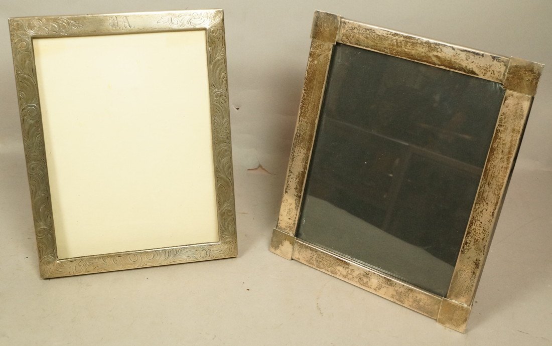 Lot of 2 sterling picture frames. 1) The largest: Lot of 2 sterling picture frames. 1) The largest marked Mexico. Replaced copper brackets to hold back. 2) One with etched scroll design monogramed "RA". Replaced back is missing all brackets to secure