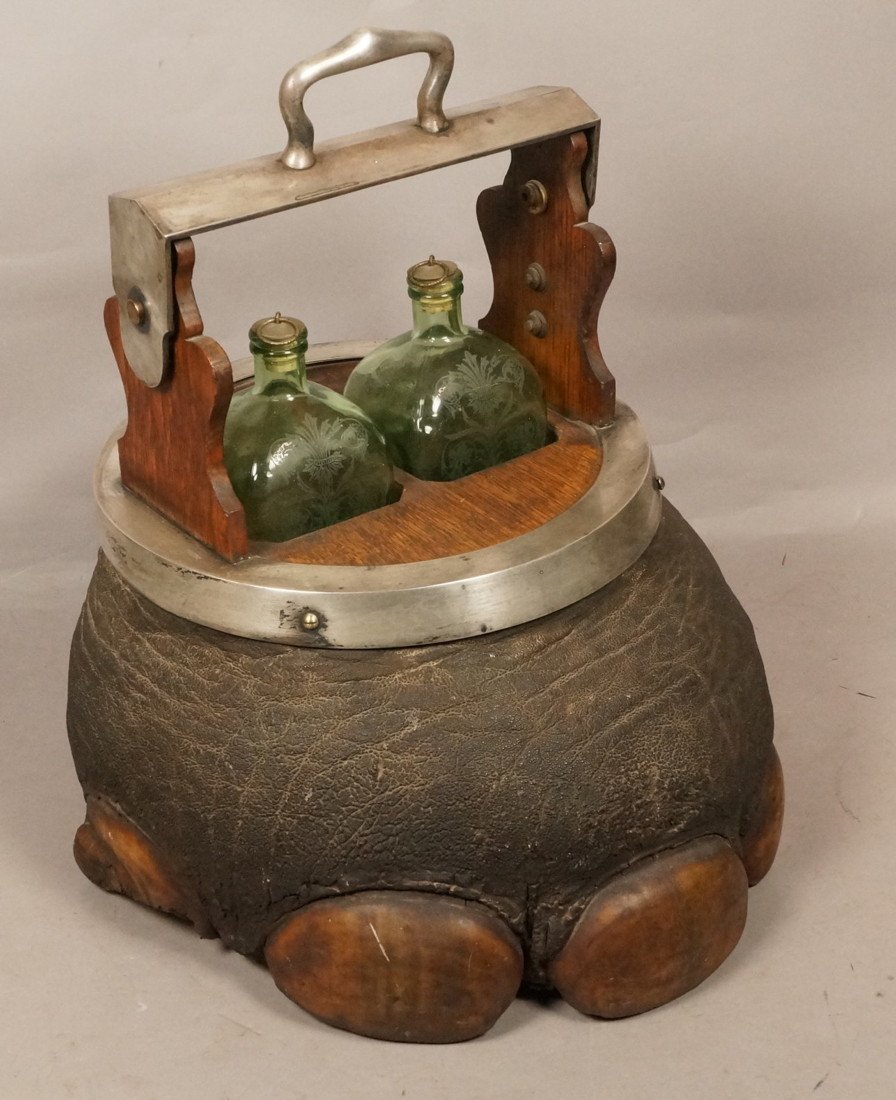 Vintage Elephant Foot Form Tantalus. Two Decorate: Vintage Elephant Foot Form Tantalus. Two Decorated Square Green Glass Bottles. Taxidermy Trophy. -- Dimensions: H: 17 inches: W: 16 inches: D: 16 inches --- US Shipping charge: $50