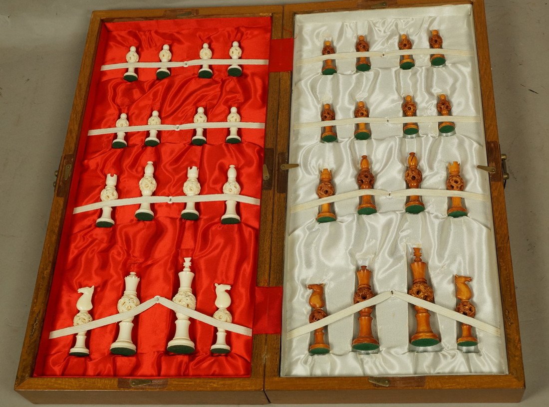 Carved Ivory Chess Set. Boxed. Carved Sphere with: Carved Ivory Chess Set. Boxed. Carved Sphere within a sphere within a sphere design. Carved Dragon. In fitted box which becomes chess board. Tallest piece is 4" high-- Dimensions: --- US Shipping char