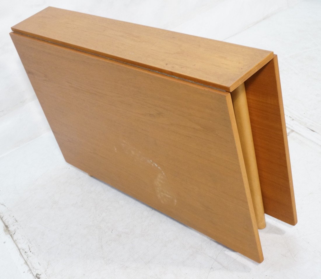 Danish Teak Drop Side Dining Table. Swing out leg: Danish Teak Drop Side Dining Table. Swing out legs. Each drop is 26" long. Table is 59.75" extended. Metal joints on legs.-- Dimensions: H: 28.5 inches: W: 10 inches: D: 43.25 inches ---