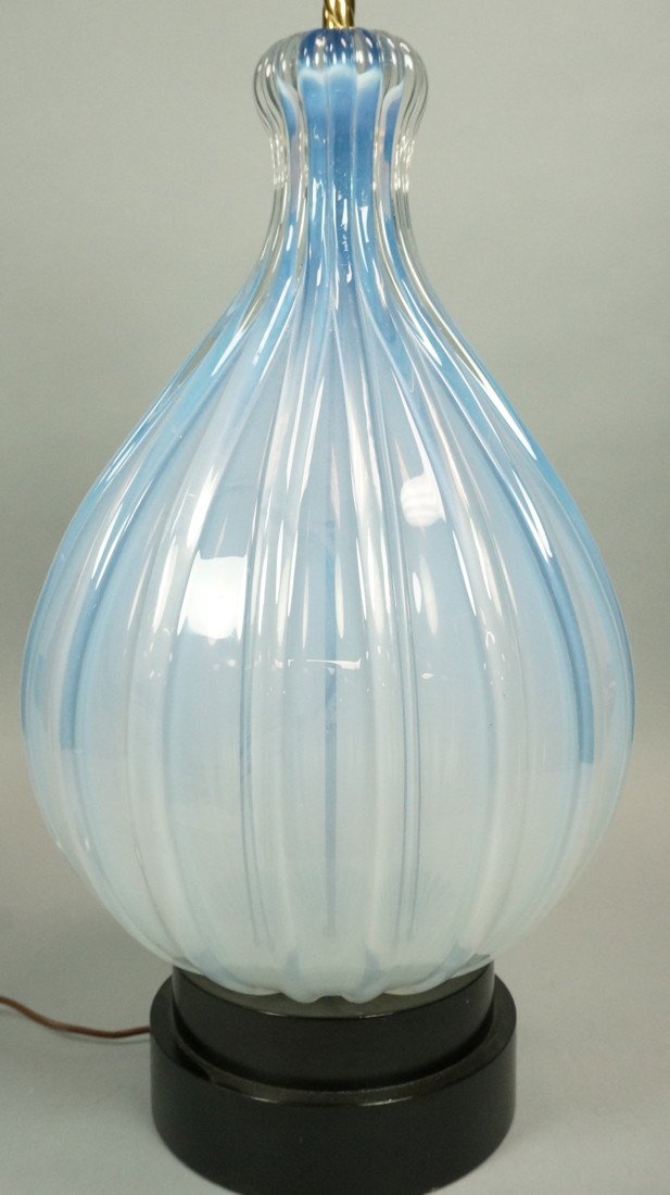 Light Blue Art Glass Table Lamp. Ribbed Bulbous F: Light Blue Art Glass Table Lamp. Ribbed Bulbous Form. Black ebonized wood base.-- Dimensions: H: 33 inches: W: 13 inches ---