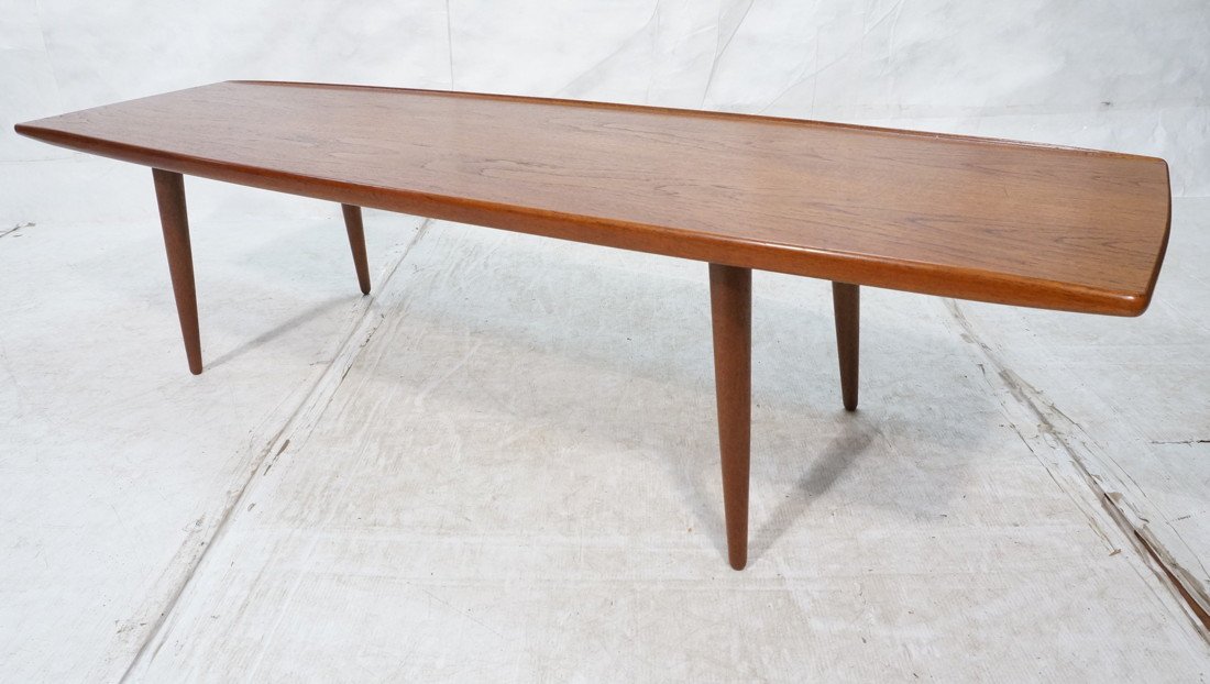 Danish Modern Teak Coffee Cocktail Table. Raised: Danish Modern Teak Coffee Cocktail Table. Raised Edge. Tapered Legs. Nice style.-- Dimensions: H: 18 inches: D: 22 inches: L: 72 inches ---