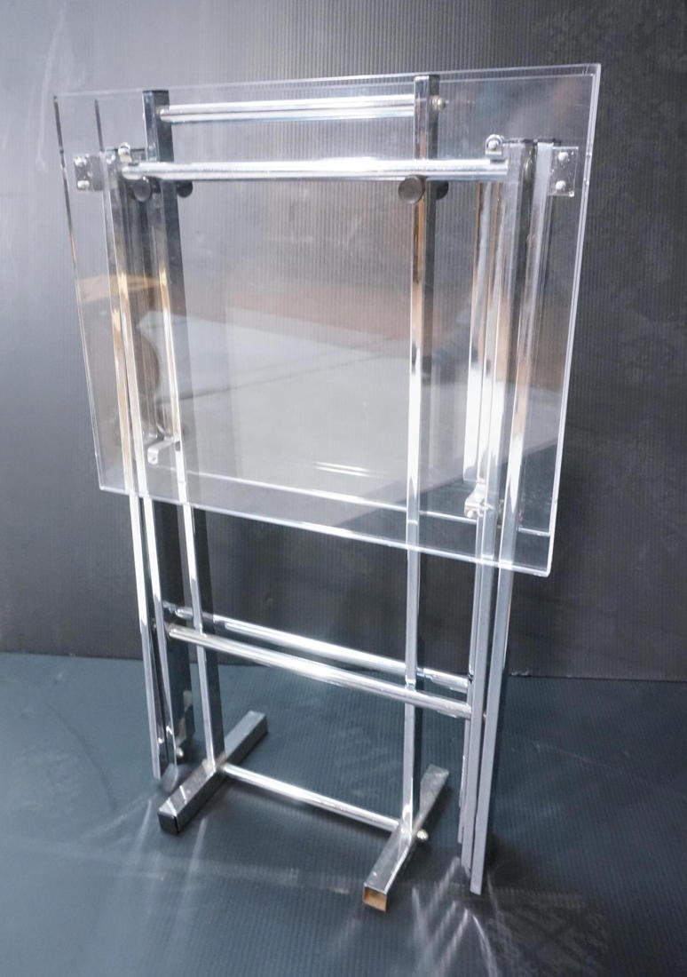 Lucite Folding TV Tables on Chrome Stand. Moderni: Lucite Folding TV Tables on Chrome Stand. Modernist design stand holds two collapsible trays. -- Dimensions: H: 30.5 inches: W: 19 inches: D: 8 inches ---