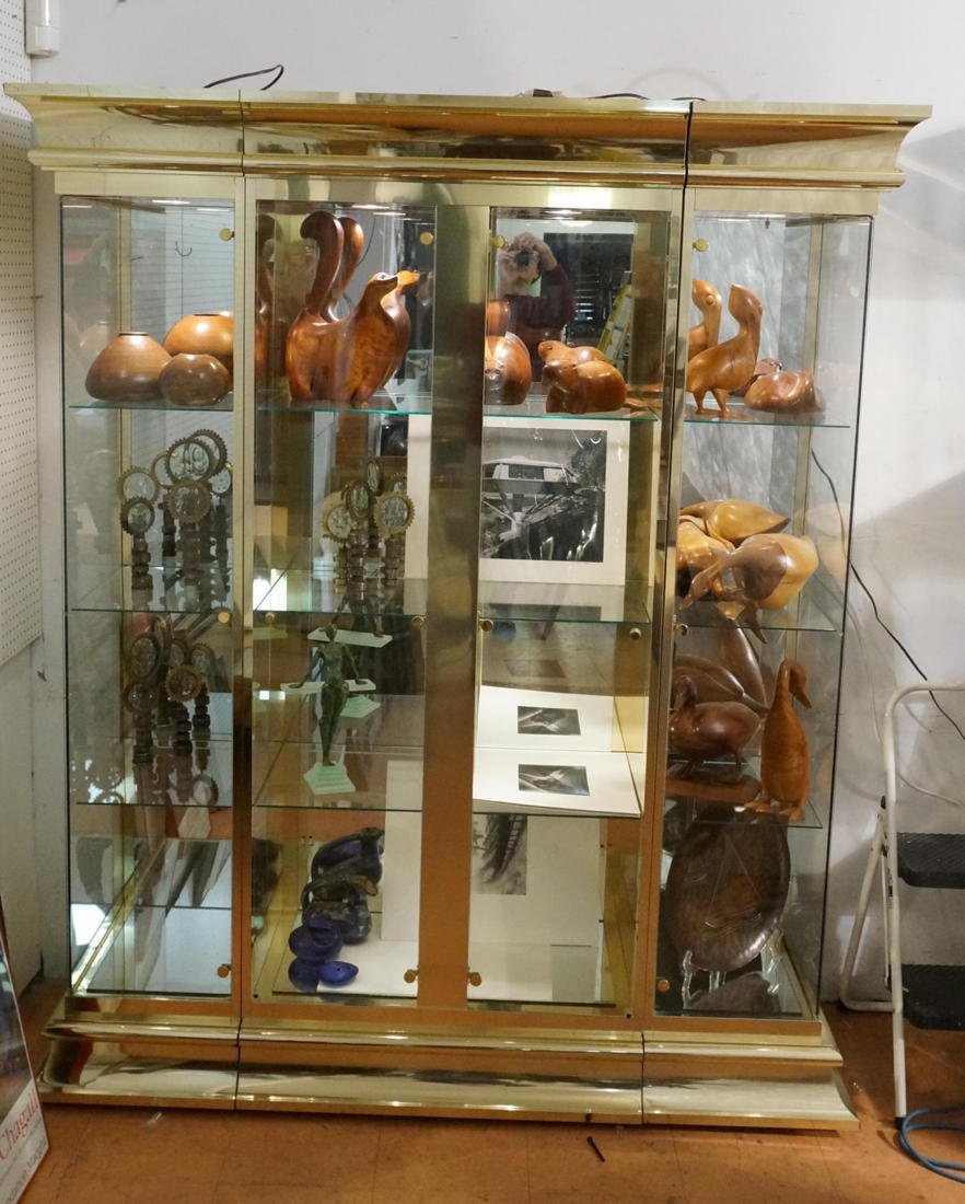 MASTERCRAFT style 3 Part Brass Display Cabinet Sh: MASTERCRAFT style 3 Part Brass Display Cabinet Shelf. Mirror Back & Bottom. Glass Shelves. Four Doors. Lights up. Ogee Top & Base Trim. -- Dimensions: H: 83 inches: W: 69.25 inches: D: 22.25 inches --