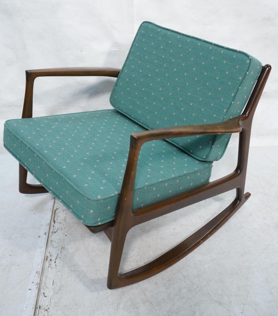 Selig Danish Modern Rocking Chair. Shaped angled: Selig Danish Modern Rocking Chair. Shaped angled back supports. Flared arms.-- Dimensions: H: 27 inches: W: 30 inches: D: 32 inches ---